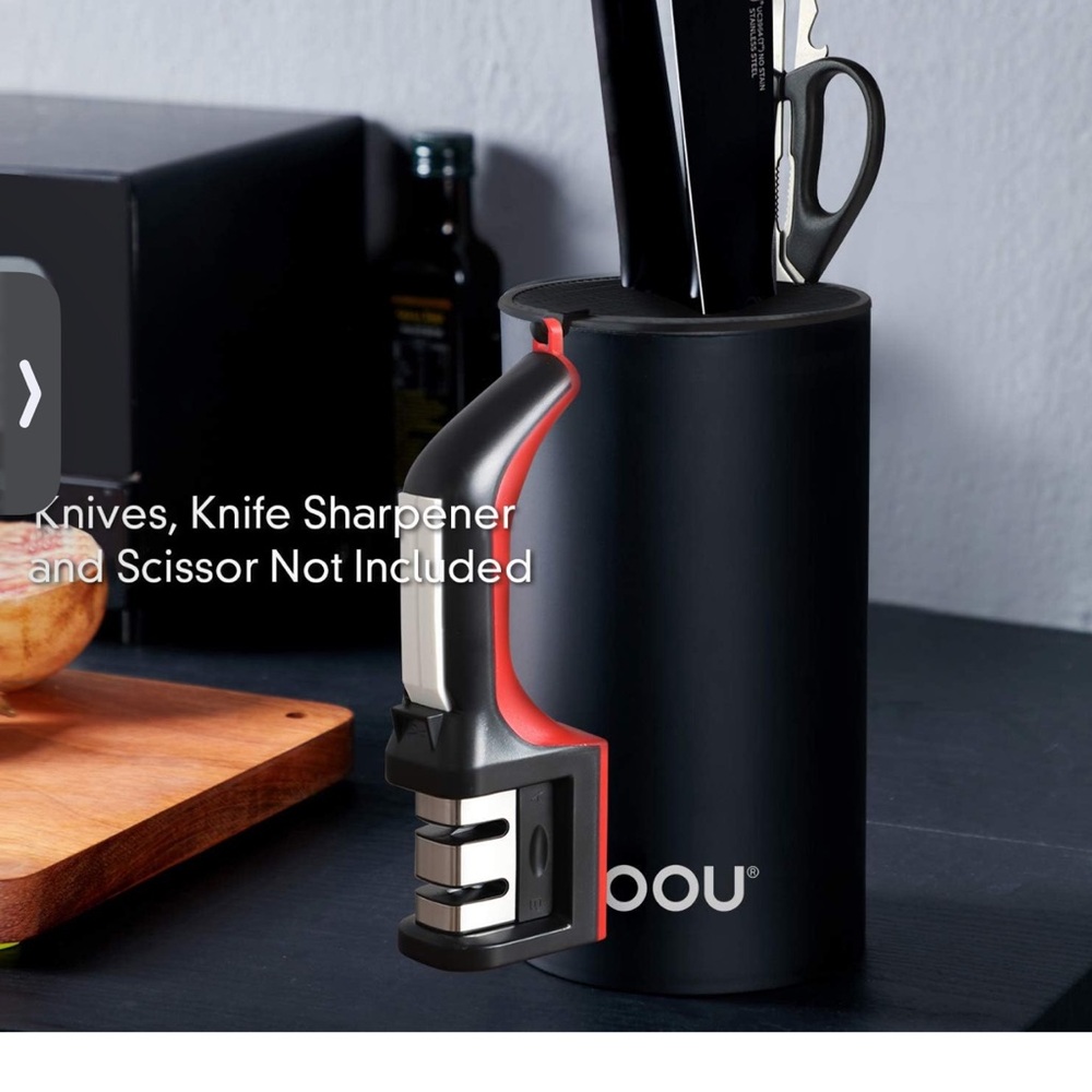 KNIFE HOLDER. SLEEK. CAN ALSO HOLD SHARPENER, SCISSORS AND NUMEROUS KNIVES!!!!